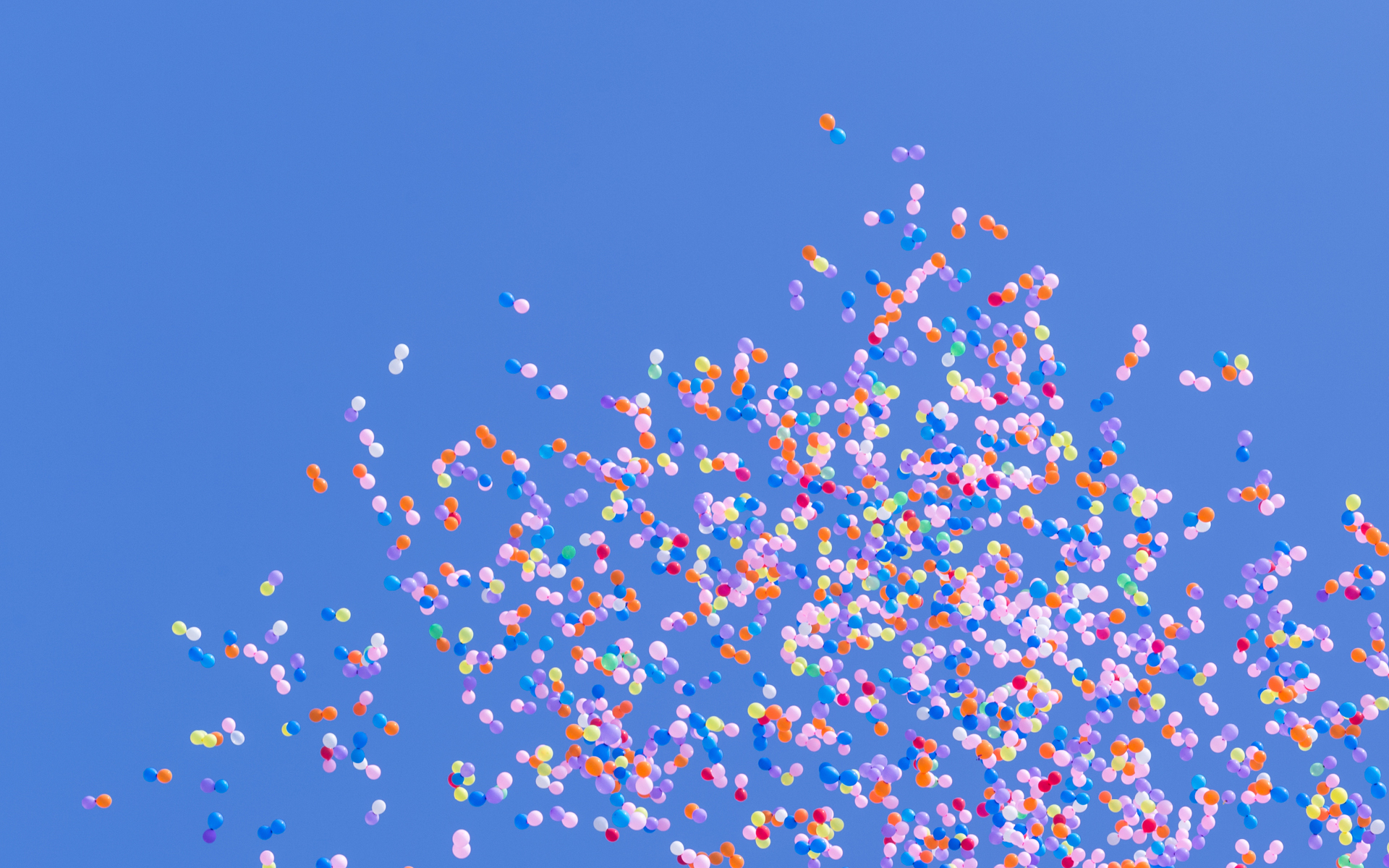coloured balloons against the sky