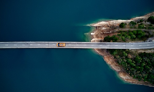 car driving over bridge 